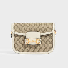 Load image into Gallery viewer, Front view of the GUCCI 1955 Horsebit Shoulder Bag in Coated GG Canvas with White Leather from front flap and horsebit gold hardware