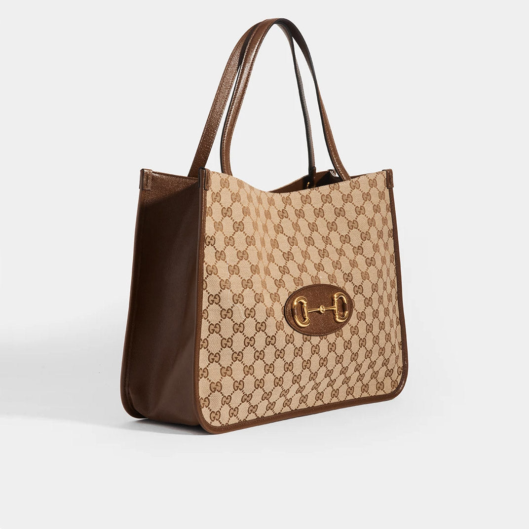 Side view of the GUCCI 1955 Horsebit Tote Bag in Brown GG Supreme Canvas