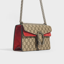 Load image into Gallery viewer, Side view of the GUCCI Dionysus GG Supreme Small Bag With Suede Trim in Red