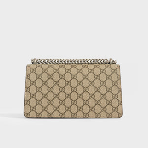 Rear view of the GUCCI Dionysus GG Supreme Small Bag With Suede Trim in Taupe