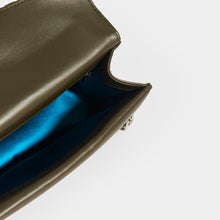 Load image into Gallery viewer, Inside detail of GUCCI Dionysus Velvet GG Handbag in Dark Green with blue delicate blue silk lining