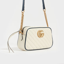 Load image into Gallery viewer, Side view of Gucci GG Marmont Camera Bag in White Leather with Navy Trim and Gold chain strap