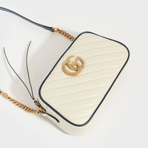 Top view of Gucci GG Marmont Camera Bag in White Leather with Navy Trim and Gold chain strap