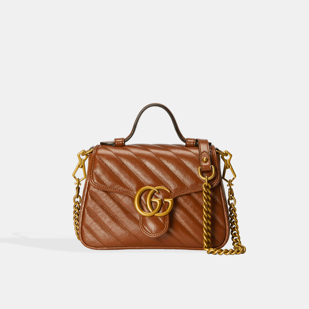 Front view of Gucci GG Marmont Mini Top Handle Bag in Brown Quilted Leather with gold chain strap
