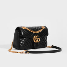 Load image into Gallery viewer, Side view of Gucci GG Marmont Small Shoulder Bag in Black Matelasse Leather with gold chain strap
