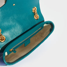 Load image into Gallery viewer, Inside view of Gucci GG Marmont Small Shoulder Bag in Blue Leather with Turquoise trim and gold chain strap