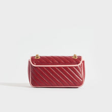 Load image into Gallery viewer, Back of the GUCCI GG Marmont Small Shoulder Bag in Red Leather with Pink Trim