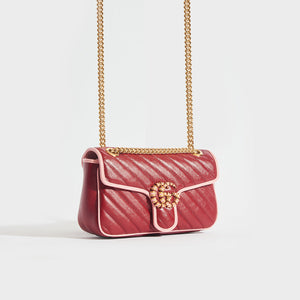 Side view of the GUCCI GG Marmont Small Shoulder Bag in Red Leather with Pink Trim