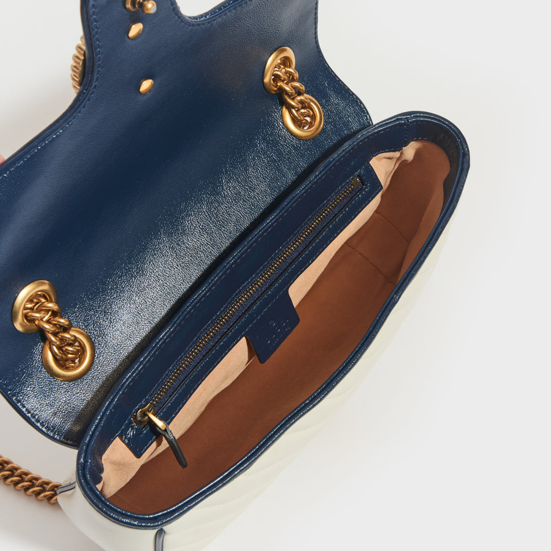 Inside view of Gucci Marmont Small Shoulder Bag in White Leather with Navy Blue trim
