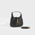 Side view of the GUCCI Jackie 1961 Mini Hobo Bag in Black Leather