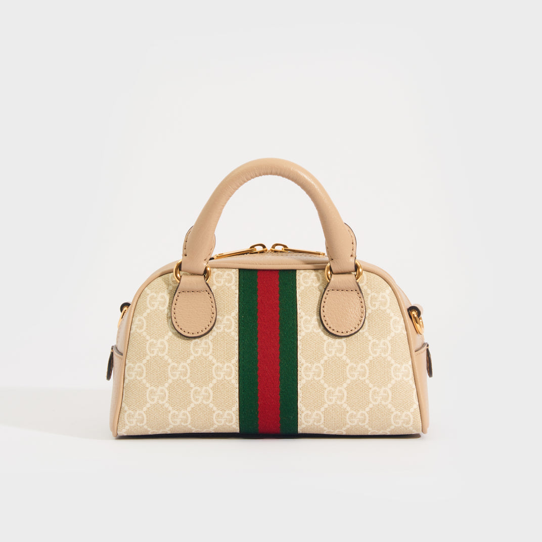 Rear view of the GUCCI Ophidia Mini GG Top Handle Bag in Beige and White GG Supreme Canvas