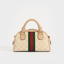 Load image into Gallery viewer, Rear view of the GUCCI Ophidia Mini GG Top Handle Bag in Beige and White GG Supreme Canvas