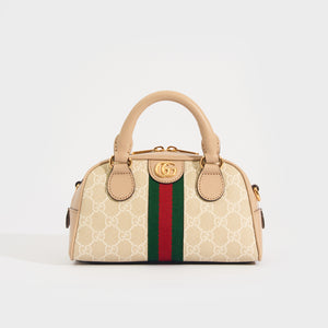 Front view of the GUCCI Ophidia Mini GG Top Handle Bag in Beige and White GG Supreme Canvas