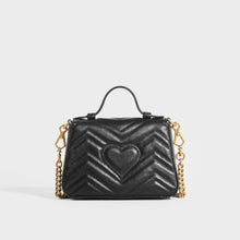 Load image into Gallery viewer, Rear view of the GUCCI GG Marmont Mini Top Handle Bag in Quilted Black Leather