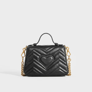 Rear view of the GUCCI GG Marmont Mini Top Handle Bag in Quilted Black Leather