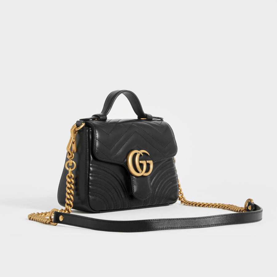 Side view of the GUCCI GG Marmont Mini Top Handle Bag in Quilted Black Leather