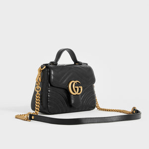 Side view of the GUCCI GG Marmont Mini Top Handle Bag in Quilted Black Leather