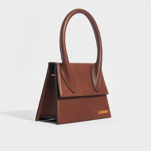 Side view of the JACQUEMUS Le Grand Chiquito in Dark Brown
