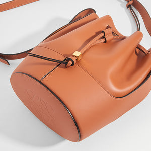 Close up detail of the LOEWE Balloon Small Bucket Bag in Tan Leather