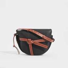 Load image into Gallery viewer, Front view of the LOEWE Gate Small Crossbody in Black with Brown Leather Trim and shoulder strap