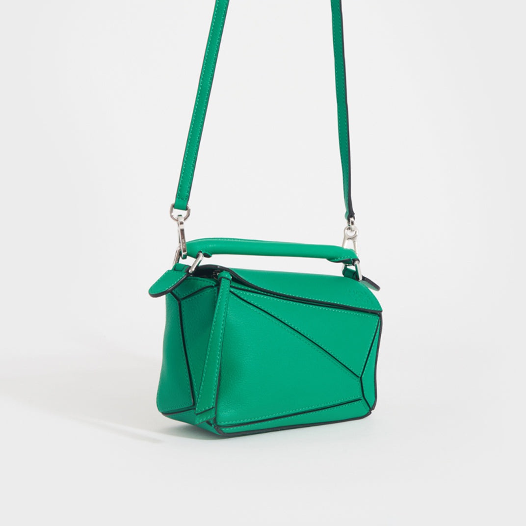 Side view of the LOEWE Puzzle Mini Leather Shoulder Bag in Jungle Green 