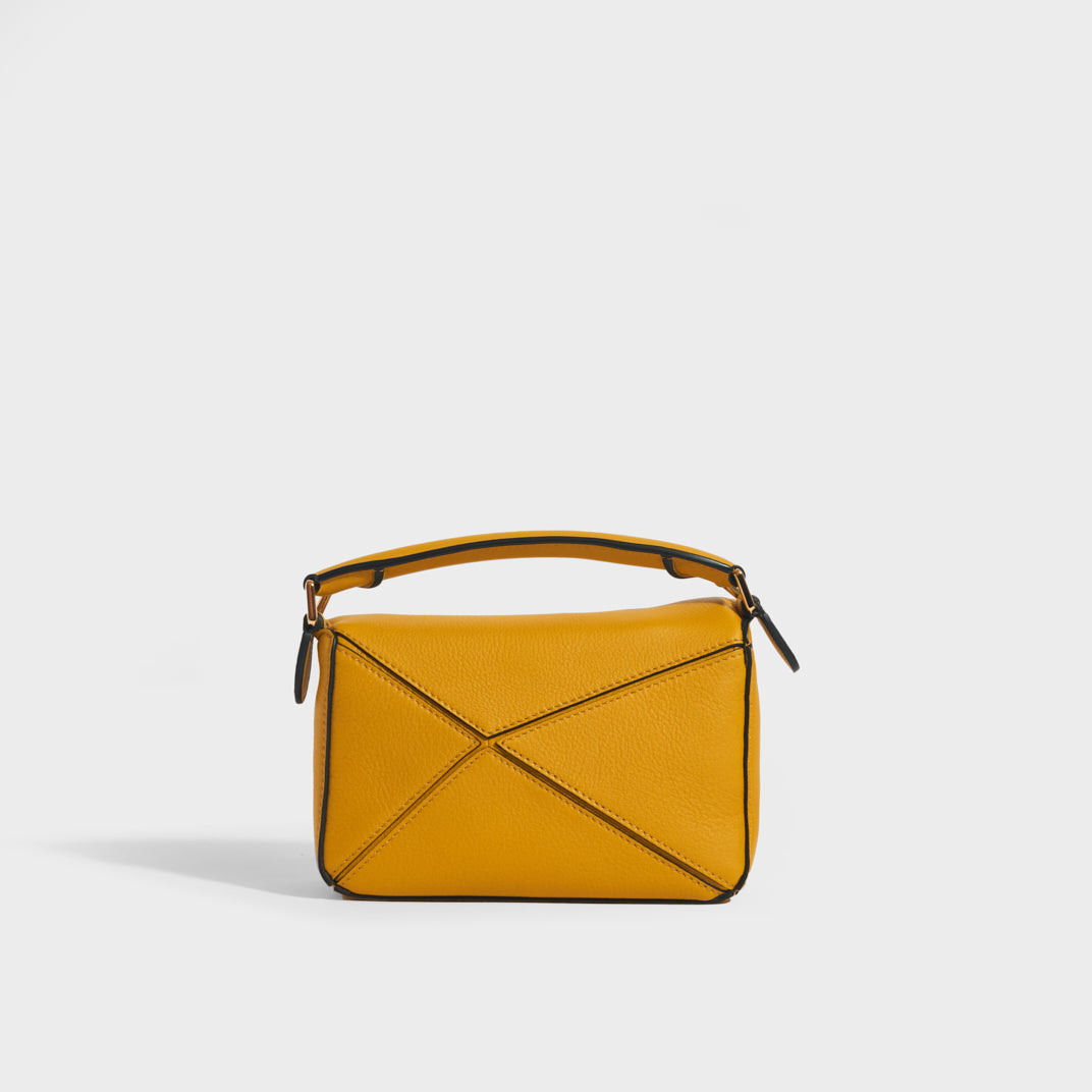 Rear view of the LOEWE Puzzle Mini Leather Shoulder Bag in Mustard
