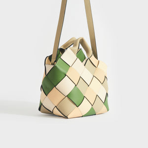 Side view of the LOEWE Woven Upcycled-Leather Basket Bag in Beige & Green