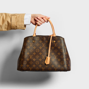 Model holding the LOUIS VUITTON Montaigne MM Tote in Monogram Canvas
