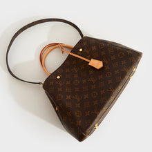 Load image into Gallery viewer, Top-down view of the LOUIS VUITTON Montaigne MM Tote in Monogram Canvas with leather top-handles and monogram canvas shoulder strap
