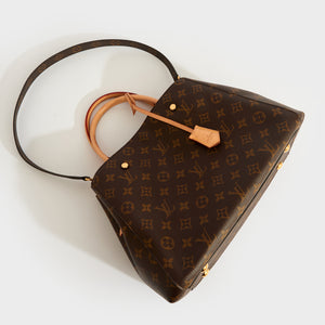 Top-down view of the LOUIS VUITTON Montaigne MM Tote in Monogram Canvas with leather top-handles and monogram canvas shoulder strap