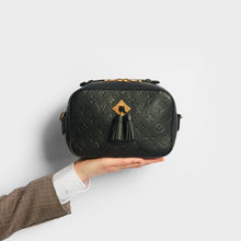 Load image into Gallery viewer, Model holding the LOUIS VUITTON Saintonge Shoulder Bag in Black Empreinte Leather