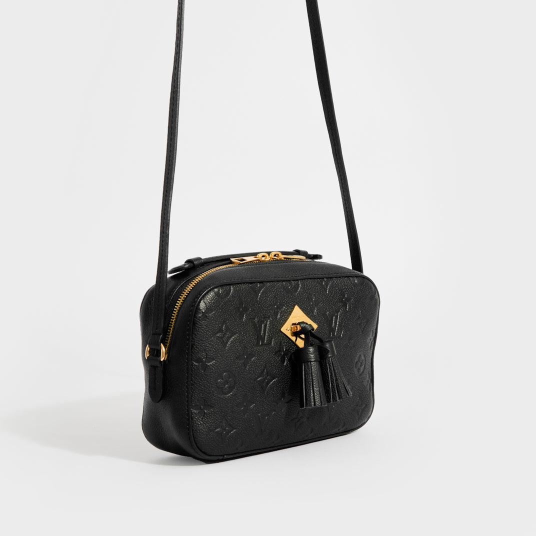 Side view of the LOUIS VUITTON Saintonge Shoulder Bag in Black Empreinte Leather