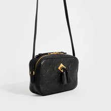 Load image into Gallery viewer, Side view of the LOUIS VUITTON Saintonge Shoulder Bag in Black Empreinte Leather