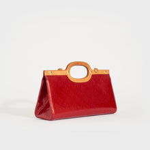 Load image into Gallery viewer, Side view of the LOUIS VUITTON Vernis Roxbury Drive Two-Way Bag in Red 2010
