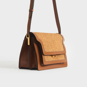 Side view of the MARNI Medium Raffia Trunk Crossbody Bag in Dark Tan