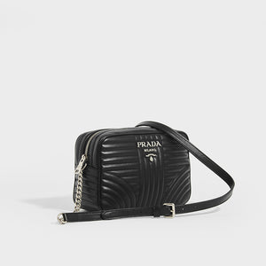 Side view of Prada Diagramme shoulder bag in black leather and silver chain and hardware