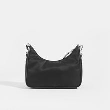 Load image into Gallery viewer, Back view of PRADA Hobo Re-edition 2005 Nylon Crossbody in Black 