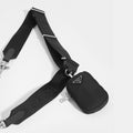 Logo strap and small pocket attachment of PRADA Hobo Re-edition 2005 Nylon Crossbody in Black 