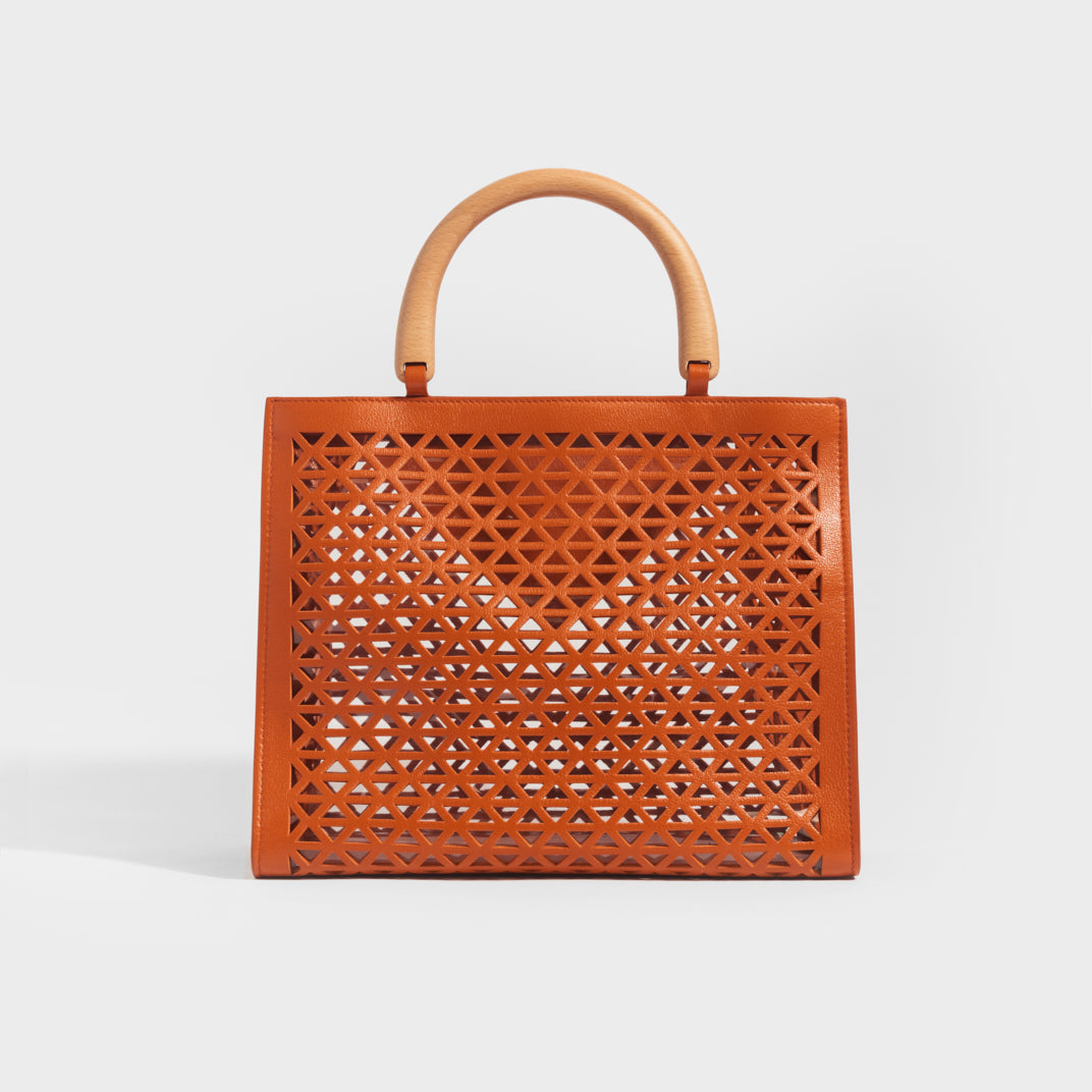 Rear view of the PRADA Leather Cut Out Shopper with Wooden Handles in Papaya 