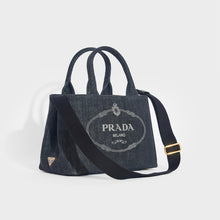 Load image into Gallery viewer, Side view of the PRADA Logo Printed Denim Tote Bag