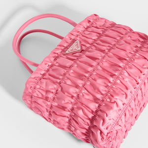 Flat shot of Prada nylon tote in Begonia pink