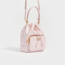 Load image into Gallery viewer, Side view of PRADA Nylon Top Handle Drawstring Bucket Bag Pink