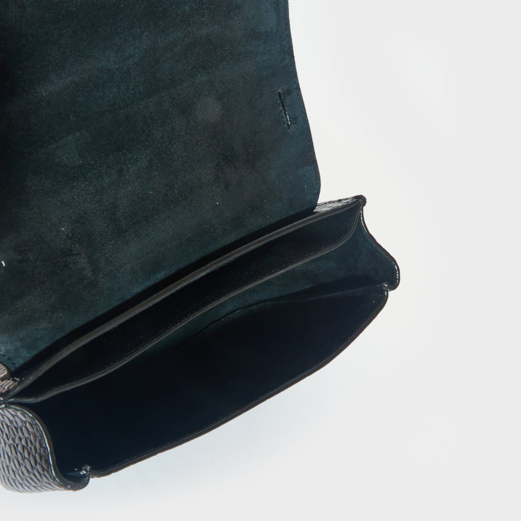 Inside view of the suede lining on the SAINT LAURENT Small Kaia Leather Shoulder Bag in Black