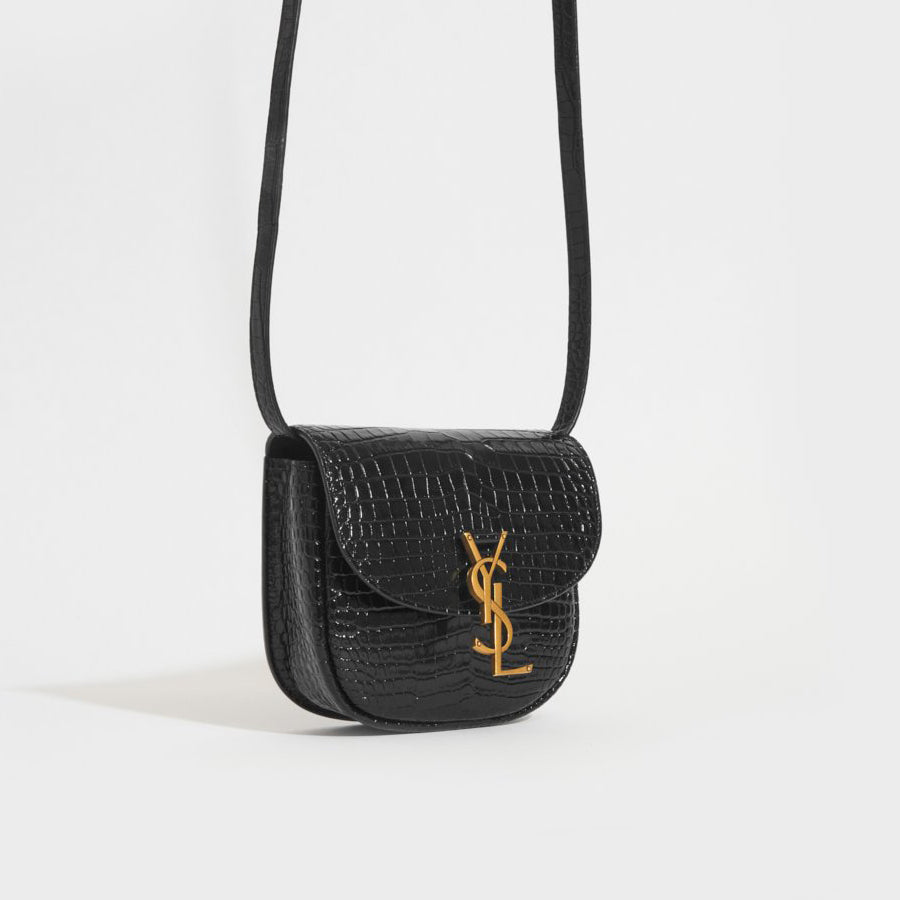 Side view of the SAINT LAURENT Small Kaia Leather Shoulder Bag in Black
