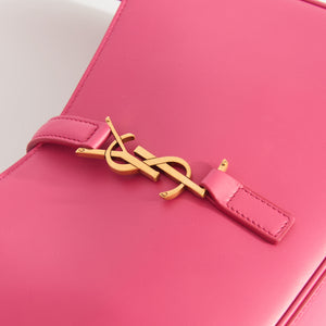 Logo shot of Saint Laurent Le 5 a 7 leather handbag in bubblegum pink iwth gold hardware.