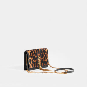 Side view of SAINT LAURENT Monogramme Kate leopard-print calf hair shoulder bag with strap and logo with tassle