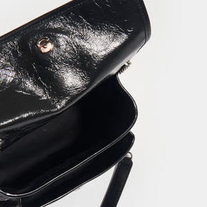 Inside view of SAINT LAURENT Niki Baby in Crinkled Leather in Black