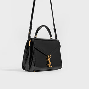 Side view of the SAINT LAURENT Medium Cassandra Croc-effect Bag in Black