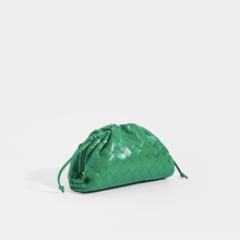 Load image into Gallery viewer, Side image of the BOTTEGA VENETA The Pouch 20 Intrecciato Crossbody in Green