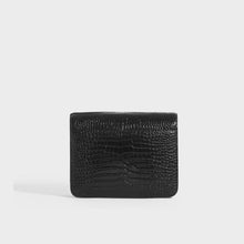 Load image into Gallery viewer, Rear view of the SAINT LAURENT Le 61 Framed Small Saddle Bag in Mock-Croc Leather in Black